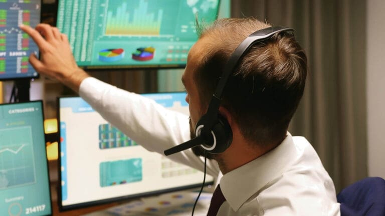 businessman looking at call center metrics
